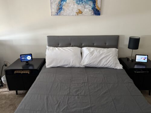 My two echo show 8s beside my bed